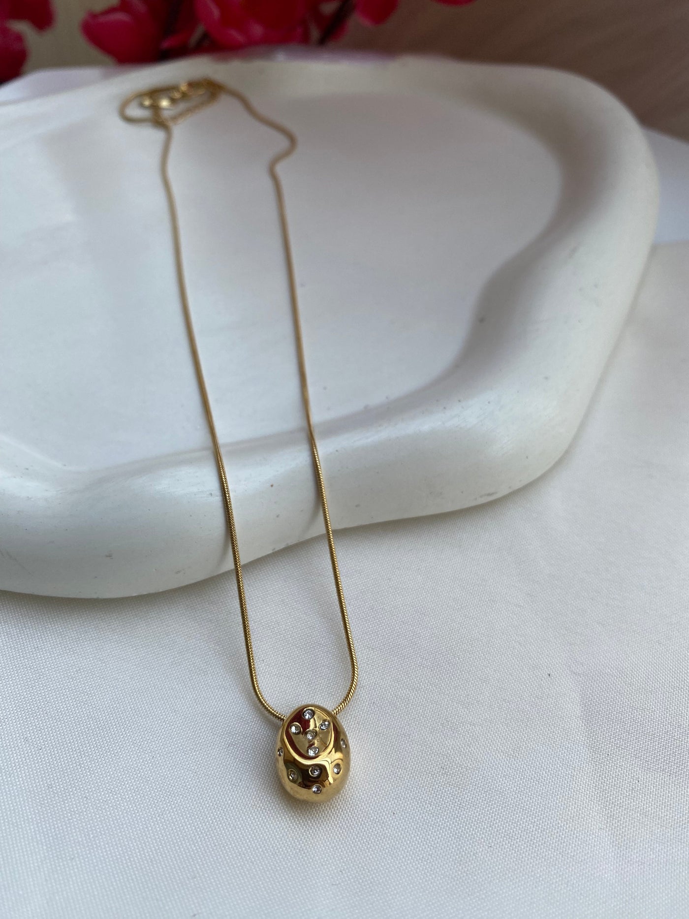 Gold Pleated drop pebble charm necklace